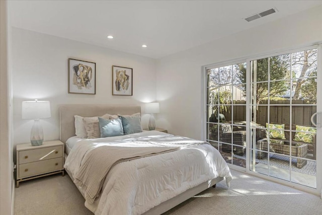 carpeted bedroom with access to outside