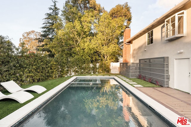 view of pool featuring a deck