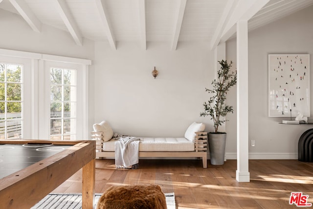 sitting room featuring hardwood / wood-style floors and beamed ceiling