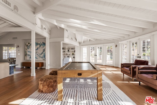 playroom featuring hardwood / wood-style flooring, lofted ceiling with beams, and french doors