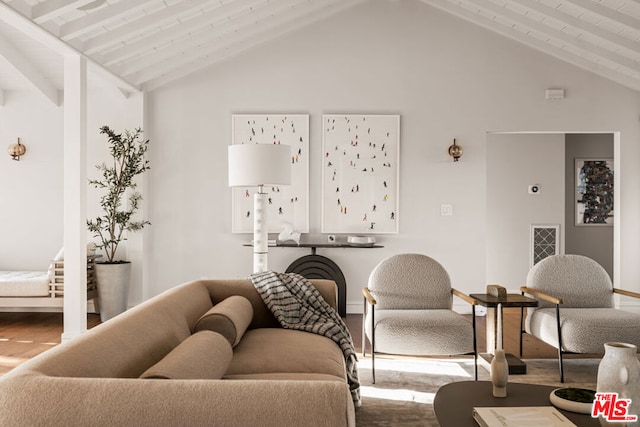 living room with vaulted ceiling with beams and wood-type flooring