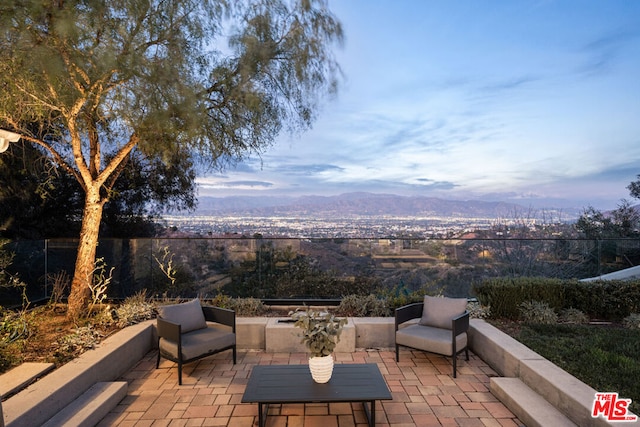 view of patio featuring a mountain view and an outdoor hangout area