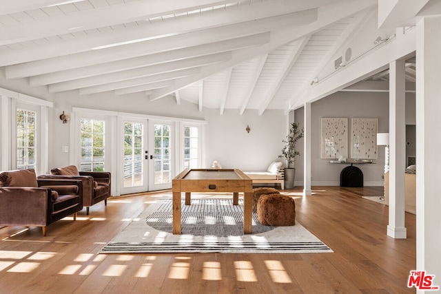 playroom featuring vaulted ceiling with beams, wood-type flooring, and french doors