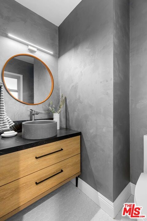 bathroom with vanity and tile patterned floors