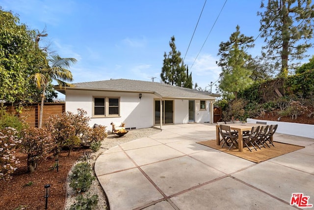 back of property featuring a patio