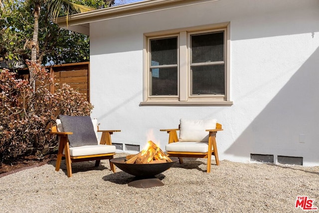 view of patio / terrace featuring a fire pit