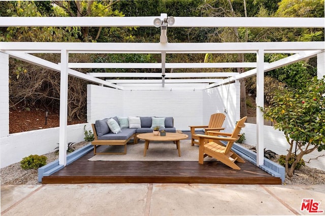 view of patio with an outdoor living space, a deck, and a pergola