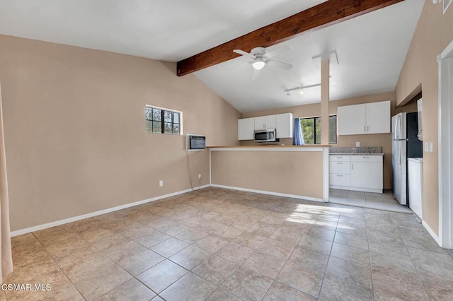 kitchen featuring ceiling fan, refrigerator, vaulted ceiling with beams, white cabinets, and kitchen peninsula