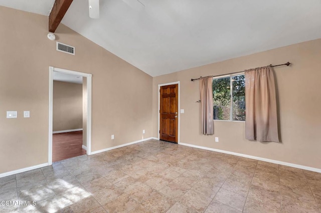 spare room featuring ceiling fan and vaulted ceiling with beams