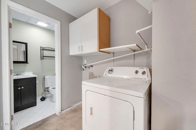 laundry room featuring cabinets, washer / dryer, and sink