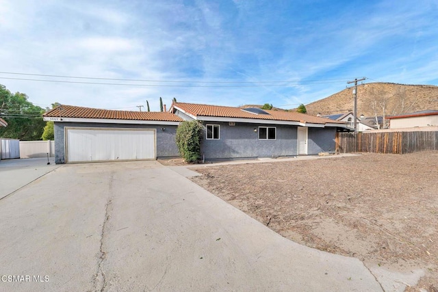 single story home with a garage