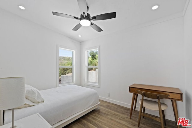 bedroom with dark wood-type flooring and ceiling fan