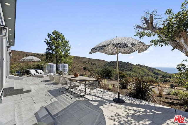 view of patio / terrace featuring a mountain view