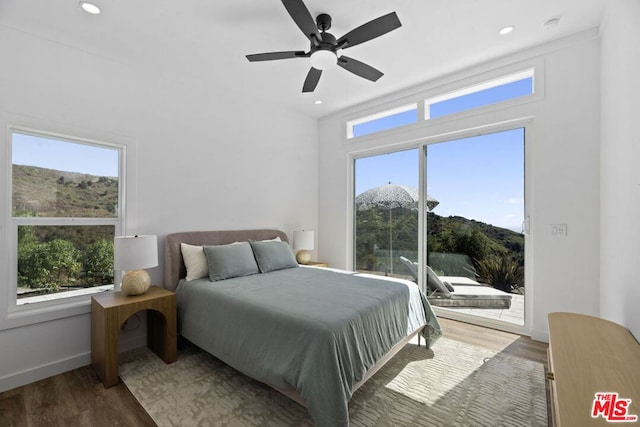 bedroom featuring dark hardwood / wood-style flooring and ceiling fan