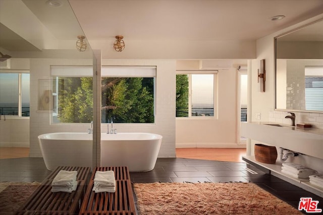 bathroom featuring a bathtub and hardwood / wood-style floors