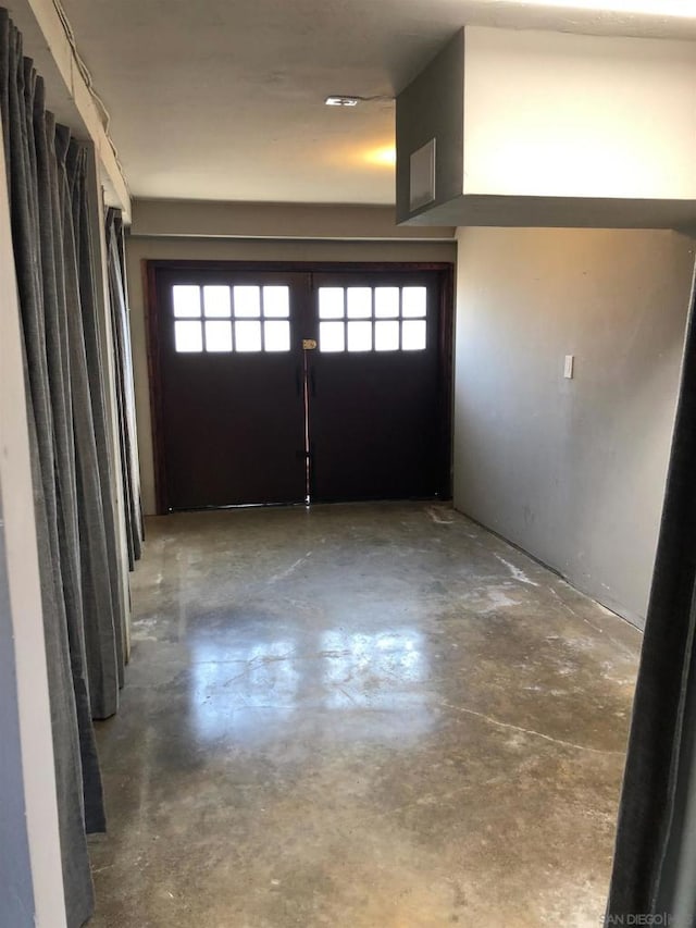 interior space featuring concrete flooring and a wealth of natural light