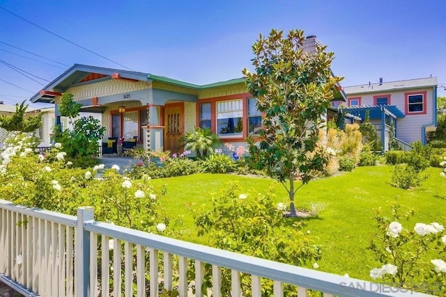 view of front of property with a front yard and a porch