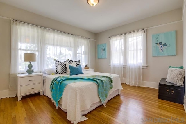 bedroom with light wood-type flooring