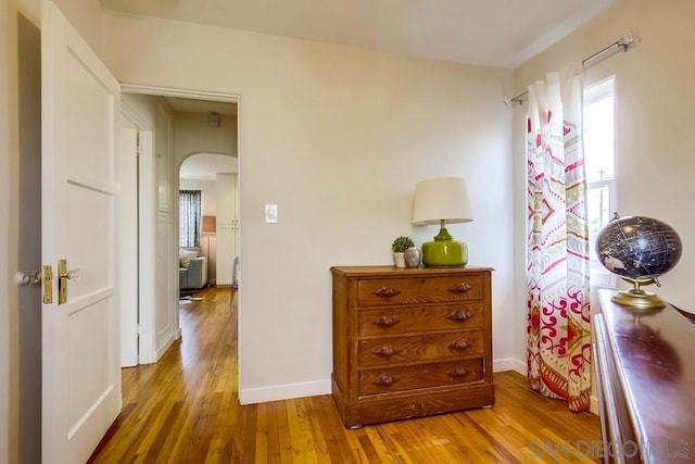 hallway featuring wood-type flooring