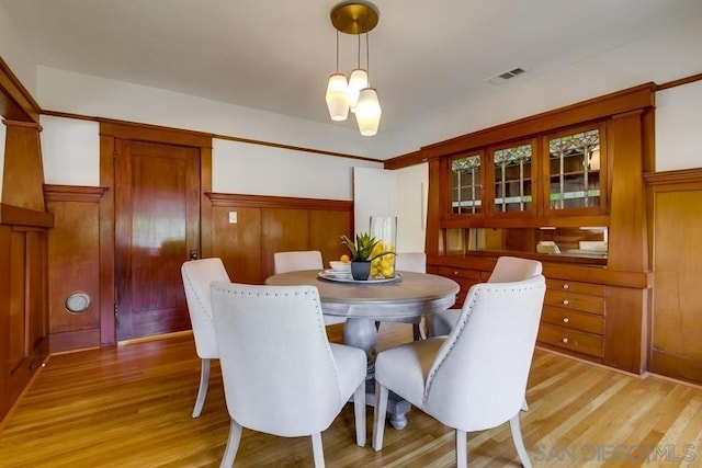 dining space featuring light wood-type flooring