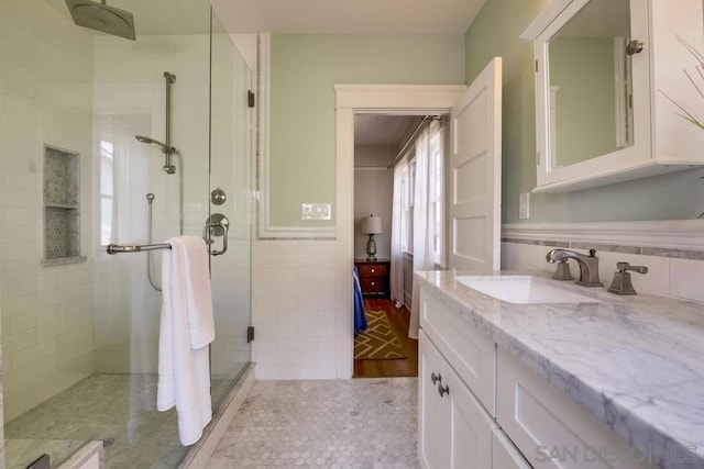 bathroom with vanity, tile patterned floors, and walk in shower