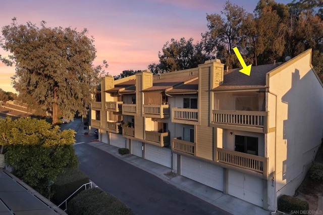 view of outdoor building at dusk