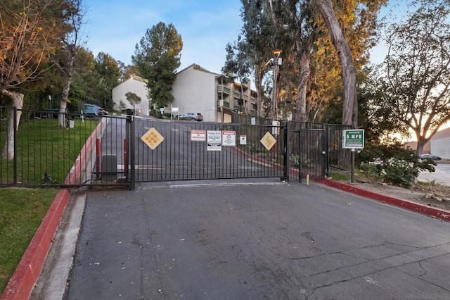 gate at dusk with a yard