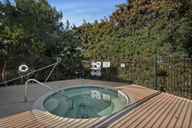 view of pool featuring a hot tub