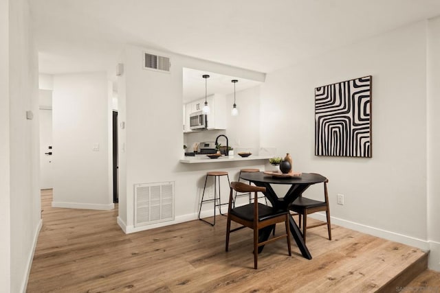 dining area featuring light hardwood / wood-style floors