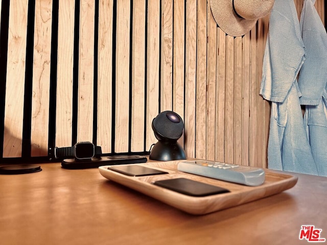 workout room featuring wood walls