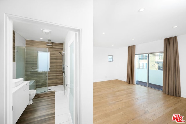 corridor with light hardwood / wood-style flooring