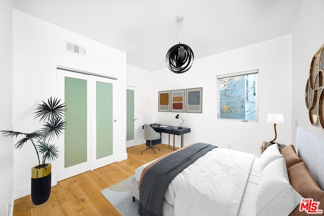 bedroom featuring wood-type flooring