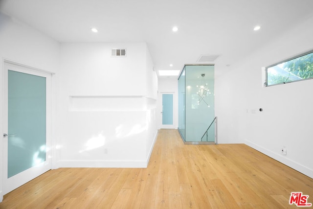 empty room with light hardwood / wood-style floors