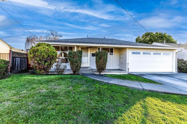 single story home featuring a garage and a front yard