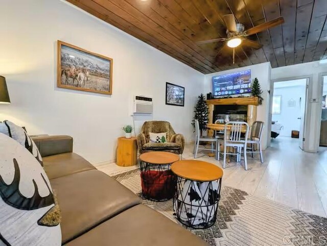 living room featuring wooden ceiling, light hardwood / wood-style floors, and ceiling fan