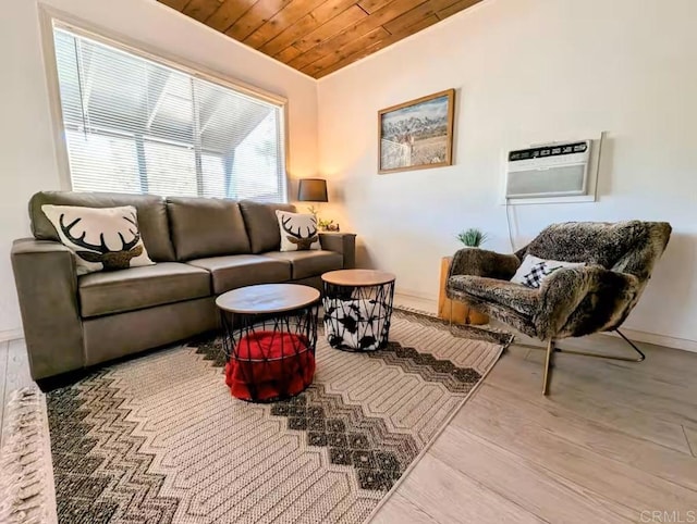 living area with wood finished floors, wooden ceiling, and a wall mounted AC