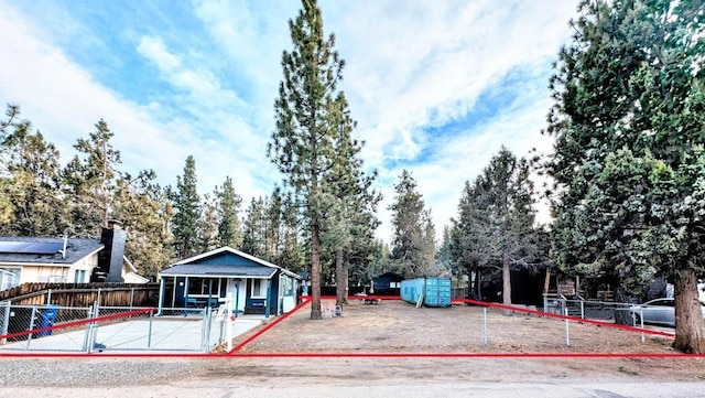 view of front facade with a gate and fence