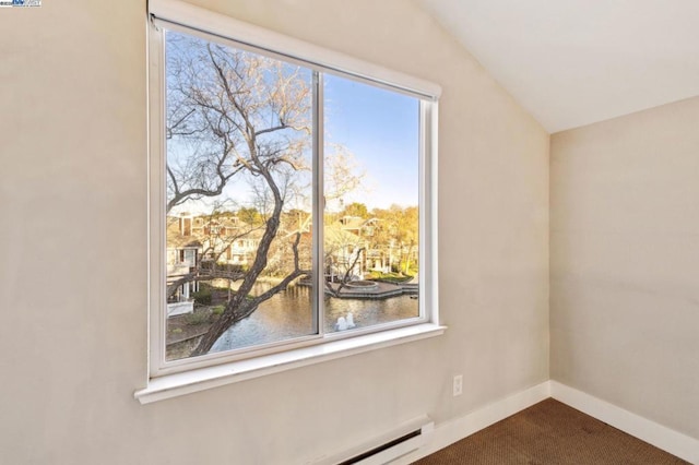 additional living space with a water view, carpet flooring, and lofted ceiling