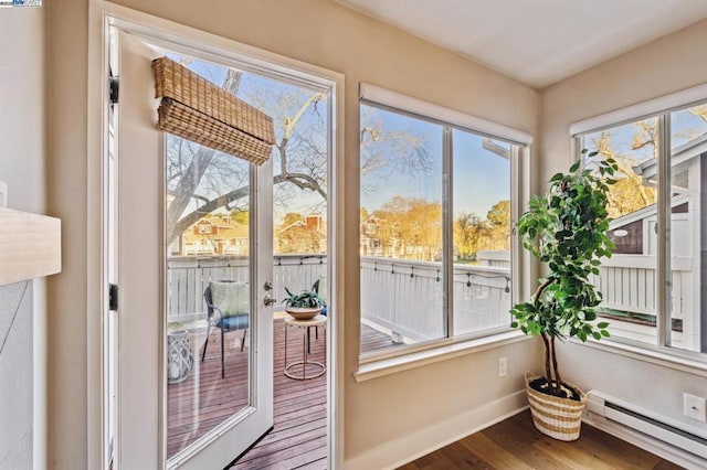 sunroom featuring a baseboard radiator