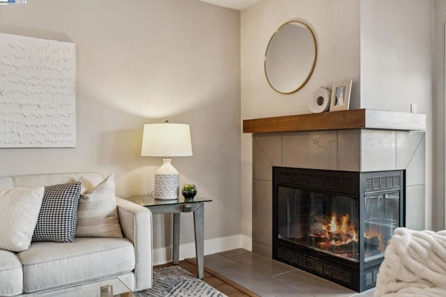 living room with hardwood / wood-style flooring and a fireplace