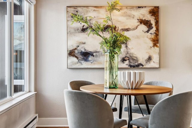 dining area featuring a baseboard radiator