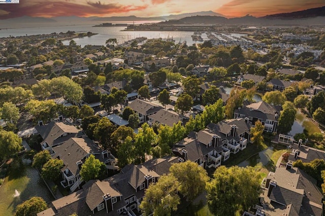 aerial view at dusk with a water view