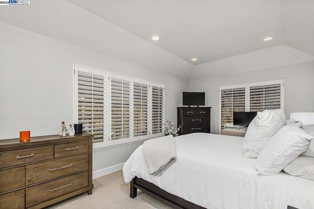 carpeted bedroom featuring vaulted ceiling