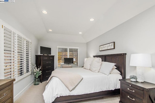 carpeted bedroom featuring lofted ceiling