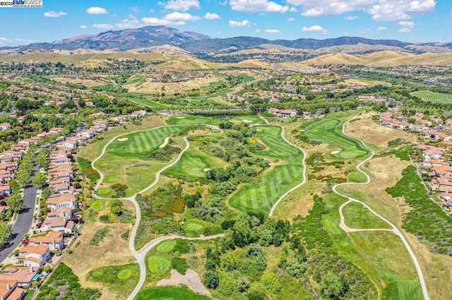 birds eye view of property with a mountain view