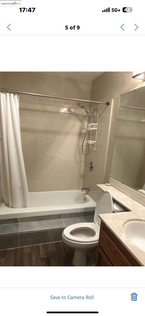 bathroom with vanity, a shower with curtain, and toilet