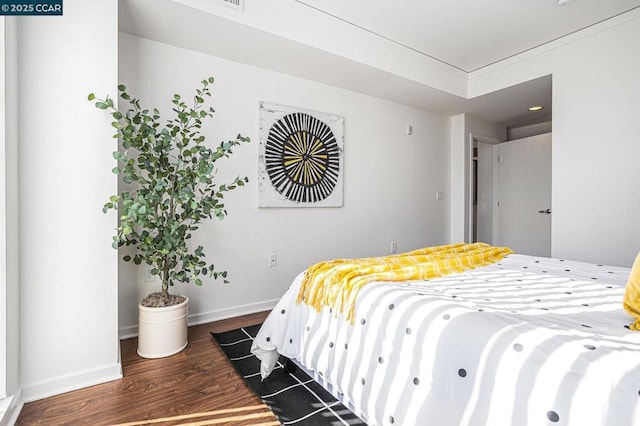 bedroom featuring dark hardwood / wood-style floors