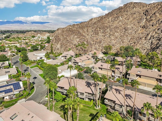 birds eye view of property featuring a mountain view