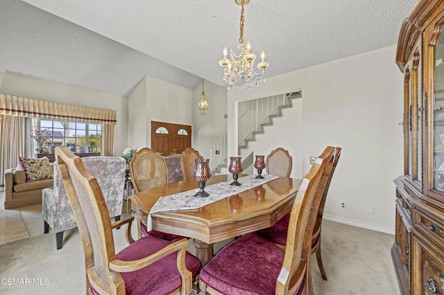 carpeted dining area with vaulted ceiling, a textured ceiling, and a notable chandelier