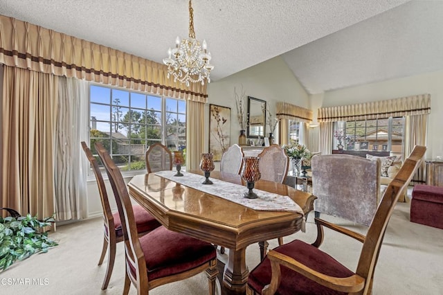 carpeted dining area featuring lofted ceiling, a textured ceiling, and a chandelier